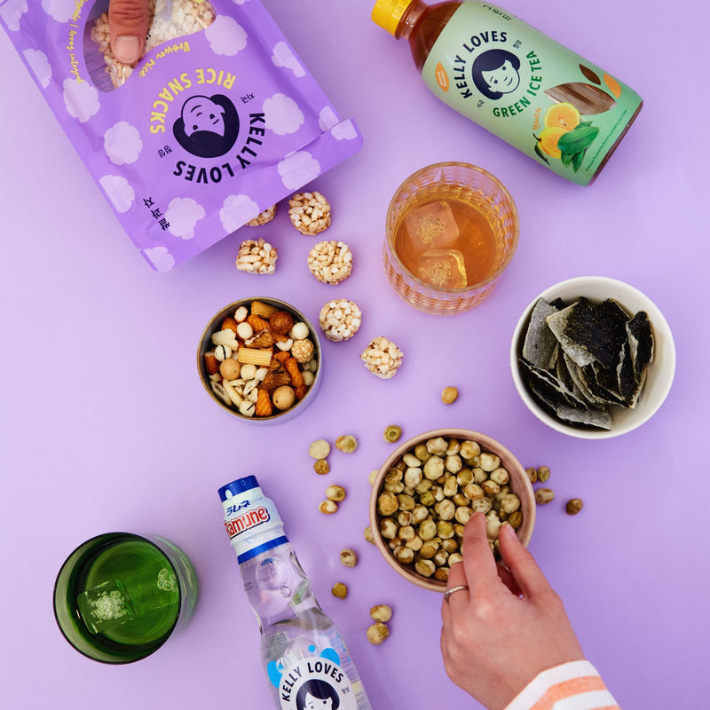 Kelly Loves Wasabi Peas with other snacks and the Yuzu Green Ice Tea